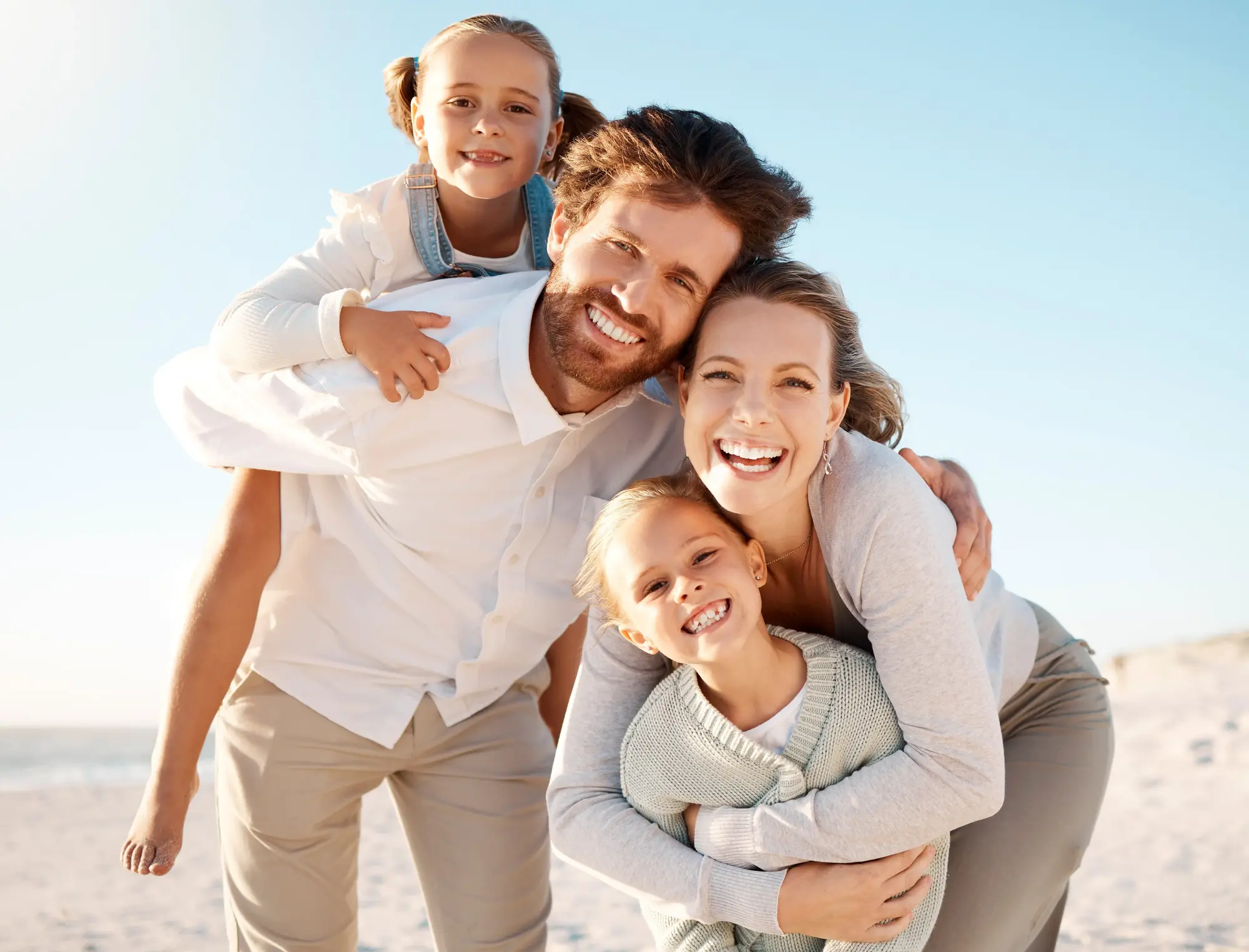 A smiling family together outdoors