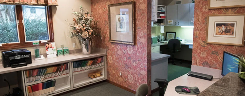A hallway and shelving inside the office