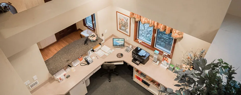 A front-desk workspace inside the office